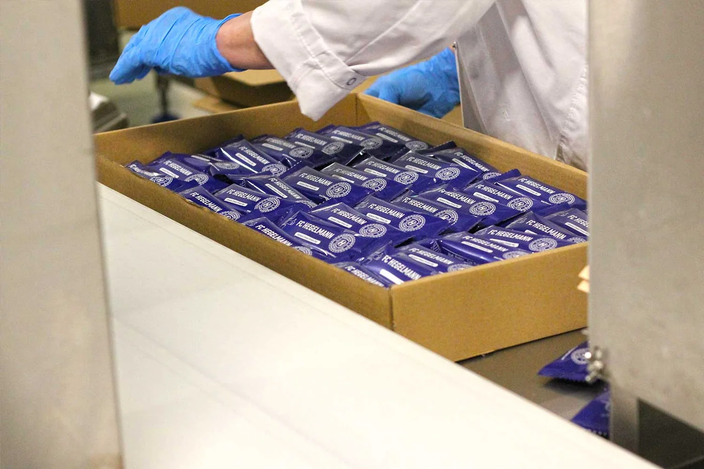 Packing bars into a box at the factory